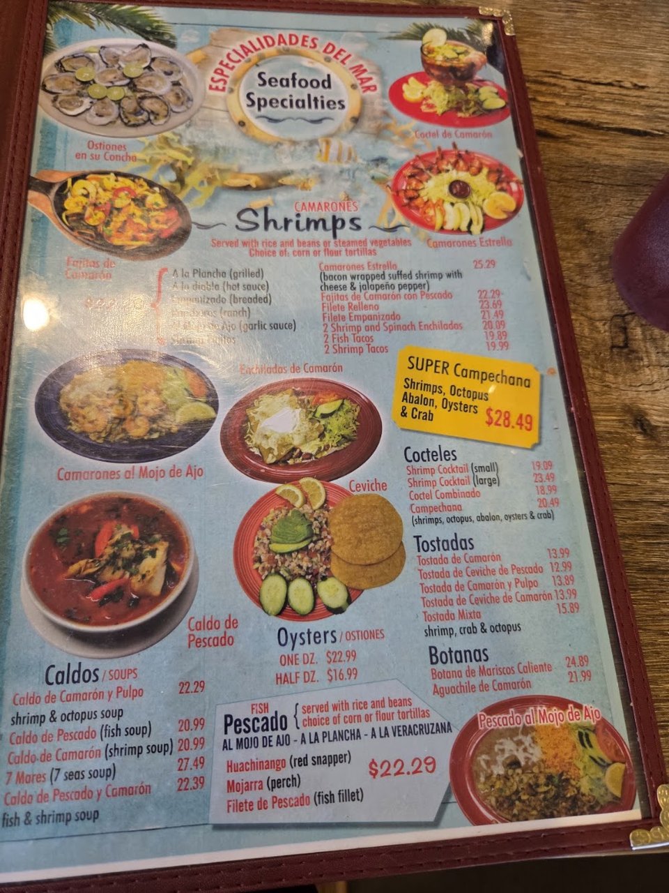 Restaurant menu featuring eggs, nachos, and salads
